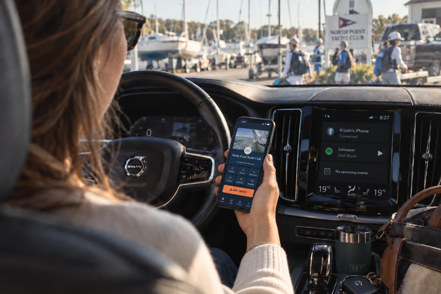 A member viewing the club app in a parked car at the marina